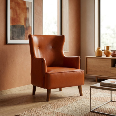Fauteuil orange pour une personne en simili cuir de luxe pour le salon. Meuble rembourré neuf.