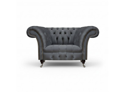 Fauteuil Chesterfield moderne gris pour salon design fauteuil inclinable élégant.