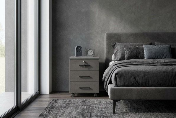 Armoire à dossiers gris uni pour bureau, design moderne avec tiroirs.