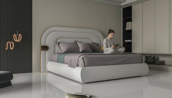Lit gris luxueux avec des détails dorés dans un design moderne et une tête de lit rembourrée