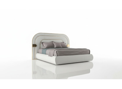 Lit gris luxueux avec des détails dorés dans un design moderne et une tête de lit rembourrée