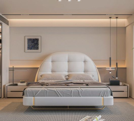 Lit gris luxueux avec des détails dorés et un design moderne à tête de lit ronde