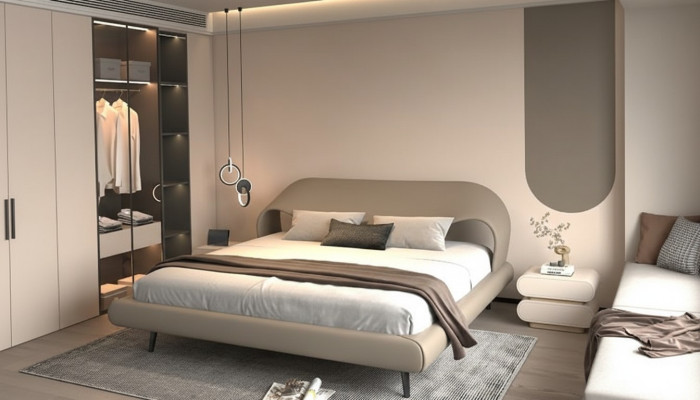 Lit gris élégant avec un design minimaliste et arrondi