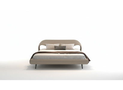 Lit gris élégant avec un design minimaliste et arrondi