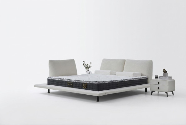 Lit boxspring moderne avec tête de lit blanche minimaliste