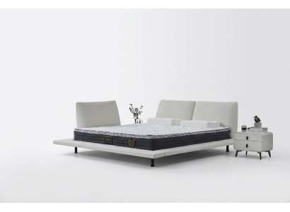 Lit boxspring moderne avec tête de lit blanche minimaliste