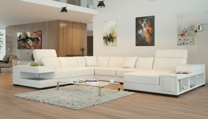 Canapé d'angle design blanc comme neige en forme de U pour une ambiance de vie luxueuse